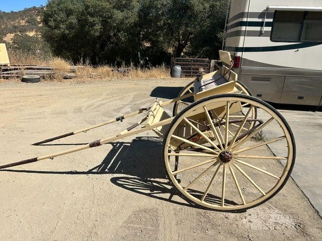 Horse-drawn cart with wagon wheel