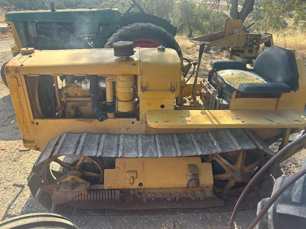 Yellow tracked skid steer